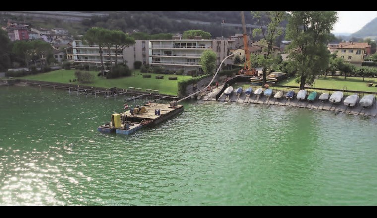 Beginn der Verlegung der Seeleitung mit gebogenen Elementen in Capolago.